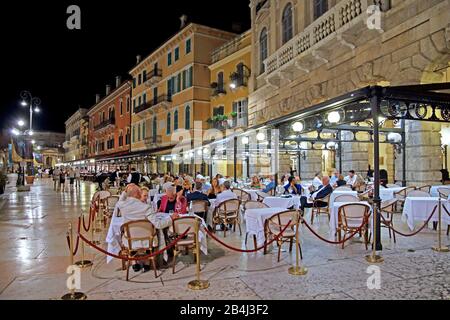 Palazzi in Piazza Bra with restaurant terraces at night, old town, Verona, Veneto, Italy Stock Photo