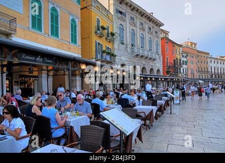 Palazzi in Piazza Bra with restaurant terraces at dusk, Old Town, Verona, Veneto, Italy Stock Photo