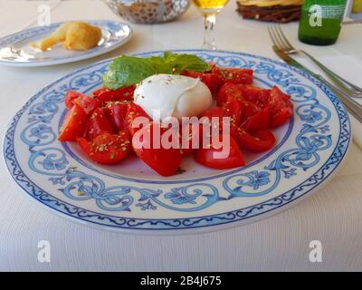 Ischia, Caprese salad, Italian appetizer, tomatoes, mozzarella, basil Stock Photo