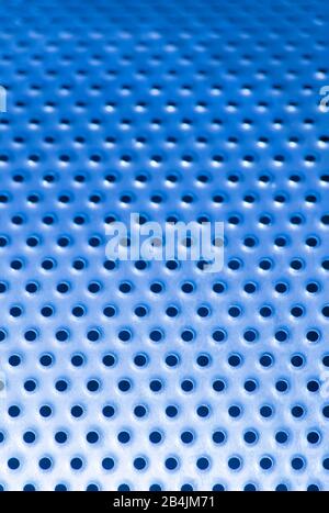 Blue pattern of iron background with many holes. metal mesh background. Stock Photo