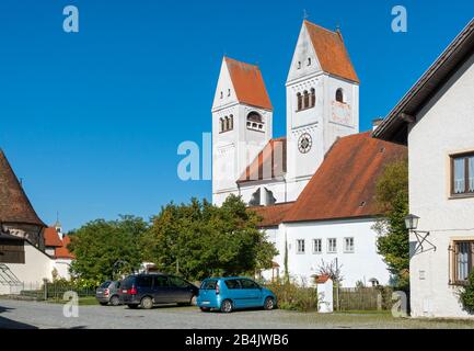 Germany, Bavaria, Steingaden, Welfenmünster, the former Premonstratensian collegiate church of St. John Baptist has been used since the secularization as a Catholic parish church. The Romanesque basilica was baroqueized in the 17th and 18th centuries. Stock Photo