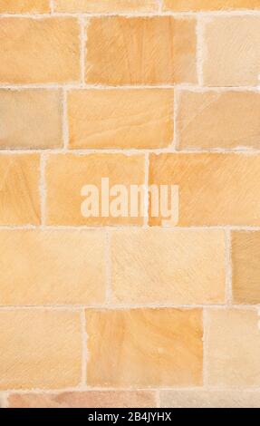 exterior sandstone wall of a Romanesque church Stock Photo