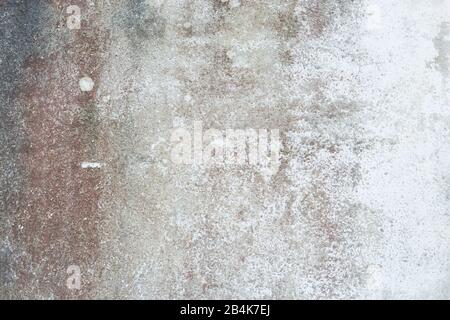 old worn out cement wall with different shades Stock Photo