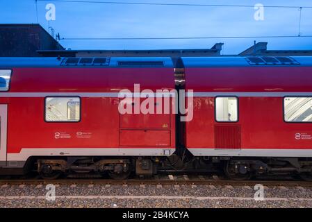 Germany, Saxony-Anhalt, Magdeburg, regional train stands in the train station, blue hour, early morning. Stock Photo