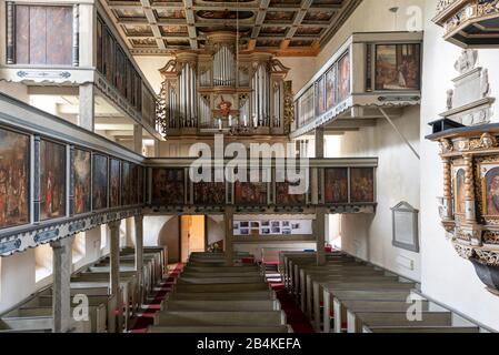 Germany, Saxony-Anhalt, Brumby, view of the organ of the Protestant village church Sankt Petri, near the highway 14. It bears the nickname Autobahnkirche Brumby. On the ceiling of the church, single-leaf woodcuts depict scenes from the Bible. Stock Photo