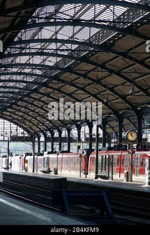 An S-Bahn is located on a track of the Wiesbaden main station. Stock Photo