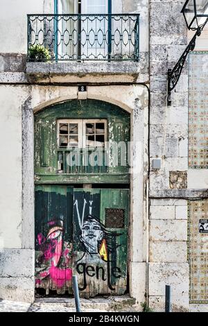 Europe, Portugal, capital, old town of Lisbon, Alfama, old house portal, weathered, with graffiti Stock Photo