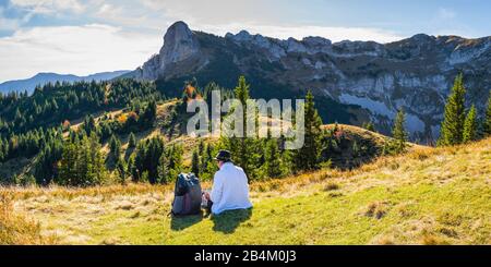 Mountain hiker takes a break, woman 50+, Ammergau Alps, Allgäu, Bavaria, Germany, Europe Stock Photo