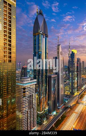 Aerial night view of the skyscrapers along the Sheikh Zayed Road in Dubai, UAE Stock Photo