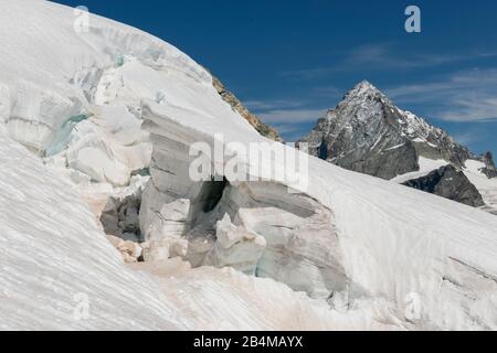 Switzerland, Valais, Haute Route Chamonix Zermatt, crevasse on the Stockji glacier with Dent Blanche Stock Photo