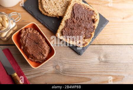 Vegan chocolate spread made of organic almond butter and organic cacao and honey Stock Photo