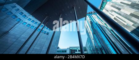 Germany, Saxony, Leipzig, facades of city skyscraper, MDR cube and Paulinum of the university, modern architecture, low angle view Stock Photo