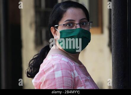 Mumbai, India. 06th Mar, 2020. A woman wearing a face mask as a precaution against the outbreak of Coronavirus walks at the Kasturba hospital.A special isolation ward has been setup at the Kasturba hospital for the treatment of the corona virus (COVID-19) patients. Credit: SOPA Images Limited/Alamy Live News Stock Photo