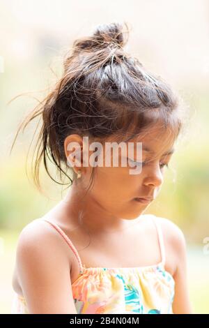 Portrait of cute little girl showing her beautiful face Stock Photo