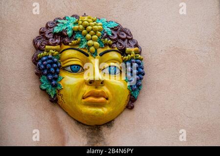Colorfully decorated ceramic faces, Taormina, Southern Italy, Europe, Sicily, Italy Stock Photo