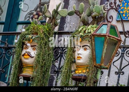 Colorfully decorated and adorned ceramic faces, Taormina, Southern Italy, Europe, Sicily, Italy Stock Photo