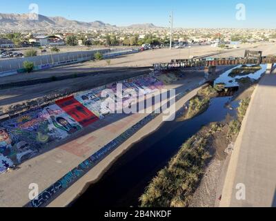 Grafitti beside Rio Grande, View of Ciudad Juarez from Paso del Norte / Stanton Street international bridge Stock Photo