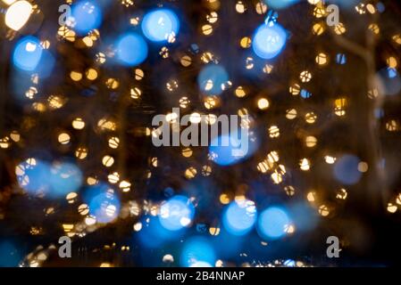 Warm lights and reflections of a Christmas light Stock Photo