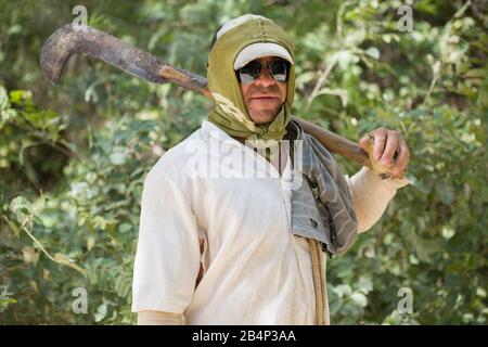 Crato, Ceará, Brazil - June 04, 2016:  Seasonal farm worker in the nature, fully covered with clothes Stock Photo