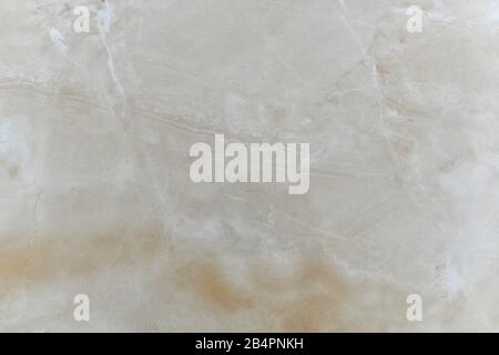 Natural beige polished marble with natural inclusions.  Stock Photo