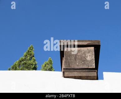 Beehive on top of the roof of a residential property image with copy space in horizontal format