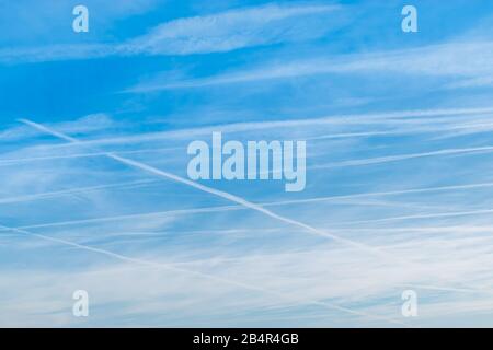 Blue sky and clouds with tracks of airplane backgrounds. Stock Photo