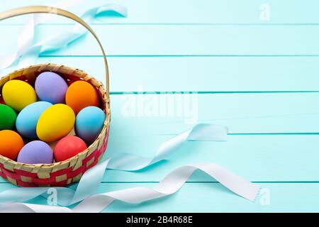 Easter Day Eggs, Decorated colorful Eggs on blue wooden table Stock Photo