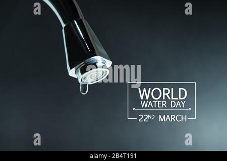 world water day, water drop on the faucet with  black backgrounds Stock Photo