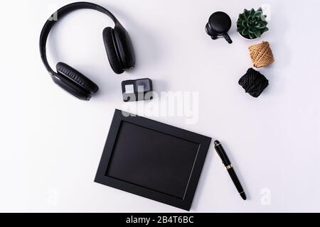 Mockup, Photo Frame, Action camera, Headphones, Pen, and Cactus, Black object on white background Stock Photo