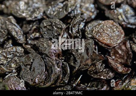 Background and texture of prunes. Close up. Stock Photo