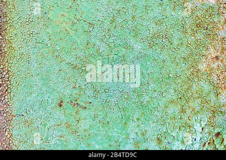 Texture and background of rusty iron with green paint. Close up. Stock Photo