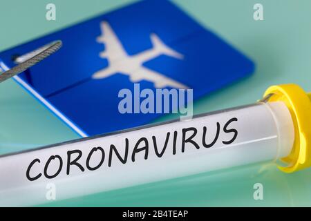 Coronavirus. Virus vial, luggage tag and boarding pass. Concept. Financial problems of airlines due to the virus Stock Photo