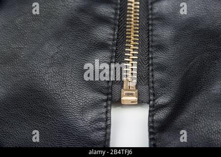 Woman leather black jacket with zip on a white Stock Photo
