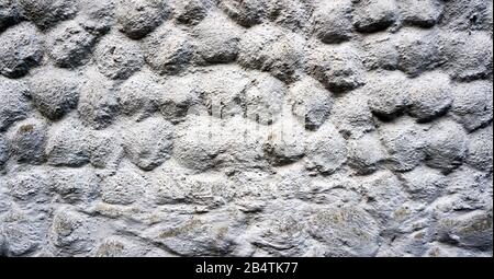 Grey stone grain bubble pattern wall spray painted textured and scratched concrete background in retro style with copy space Stock Photo