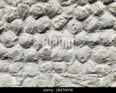 Grey stone grain bubble pattern wall spray painted textured and scratched concrete background in retro style with copy space Stock Photo