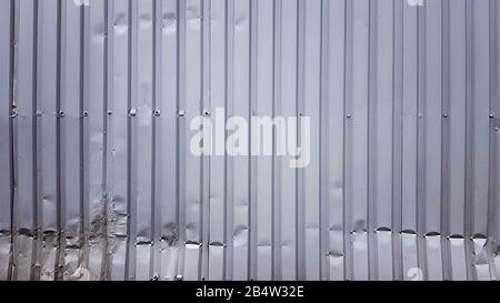 Old zinc abstract. Zinc vintage background view. crumpled metal plate of the fence. Tin roof background with a hole of rust and nails vintage style. Z Stock Photo