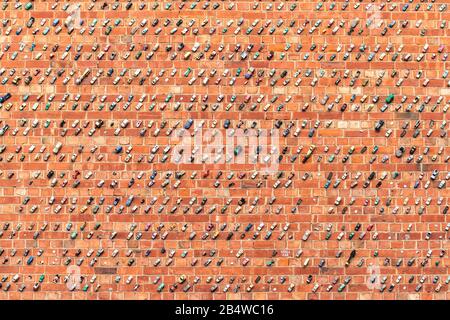 Adelaide, Australia - January 26, 2020:  Thousands of toy cars glued to the brick wall on Rosina street public car park in Adelaide city Stock Photo