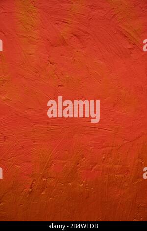 Textured red - yellow stone wall. Texture wallpaper. Stock Photo