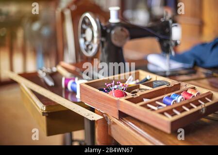sewing tools and reels of color thread on table. Handmade clothes dressmaking and sewing Concept