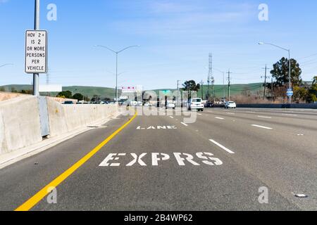 Express Lane marking on the freeway; San Francisco Bay Area, California; Express lanes help manage lane capacity by allowing single occupancy vehicles Stock Photo