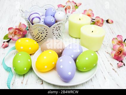 easter table setting, easter eggs, candles and blossom Stock Photo