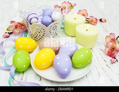 easter table setting, easter eggs, candles and blossom Stock Photo