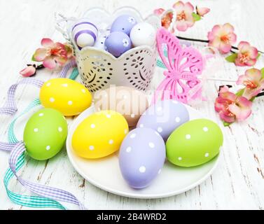 easter table setting, easter eggs, candles and blossom Stock Photo