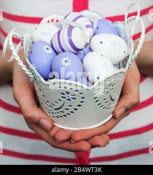 Easter eggs in a metal pot on a old wooden background Stock Photo - Alamy