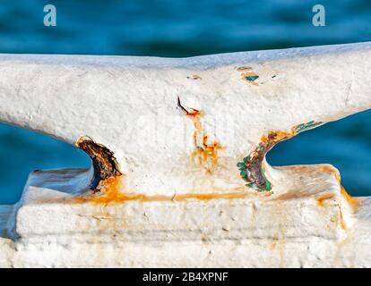 Large white metal cleat on a boat Stock Photo
