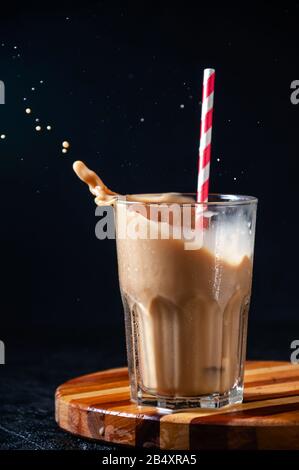 Iced cappuccino coffee with straw in plastic cup isolated on white ...