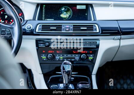 Bmw 750d climate unit and automatic gear knob, close up photo, heated seats button, ventilated seats switch, digital temperature illustration Stock Photo