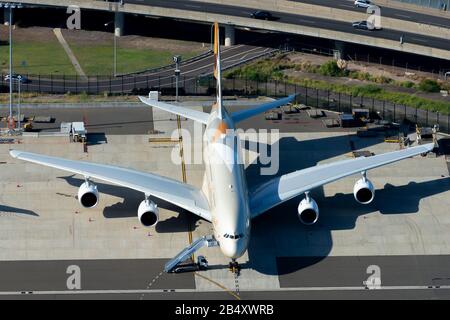 Aerial view of Etihad Airways Airbus A380. Frontal view showing four engines aircraft with huge wingspan at international airport. Sydney, Australia. Stock Photo