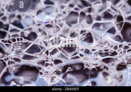 Macro of colorful soap bubble with abstract patterns and shapes, conceptual shapes, futuristic space art wallpaper Stock Photo