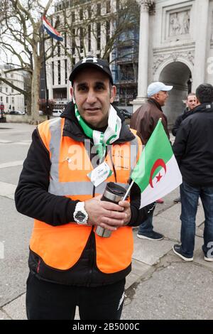 London, UK. 07th Mar, 2020. Algerian and Berber Hirak Movement Demonstration at Marble Arch. Demonstration celebrating the Revolution of Smiles, asking for the release of political prisoners. Algerian flag and the Berber or Amazigh flag flown side by side. Credit: Peter Hogan/Alamy Live News Stock Photo